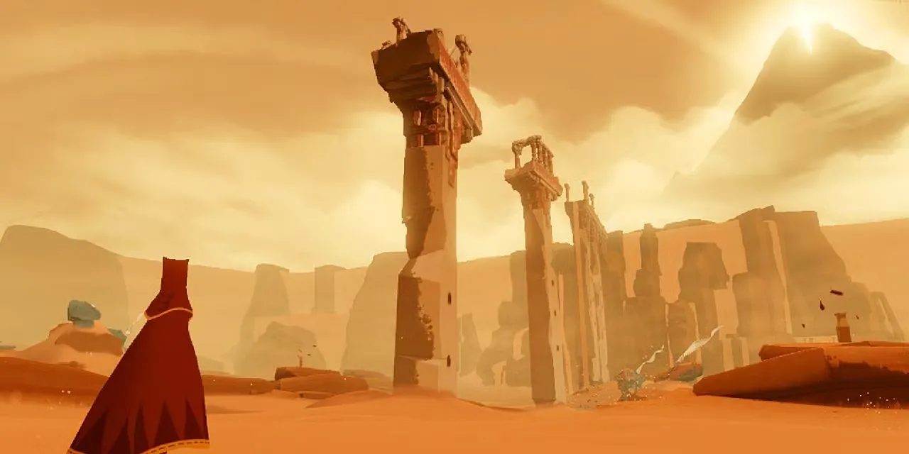 Hai lữ khách mặc áo choàng đỏ phiêu lưu qua sa mạc rộng lớn trong game Journey