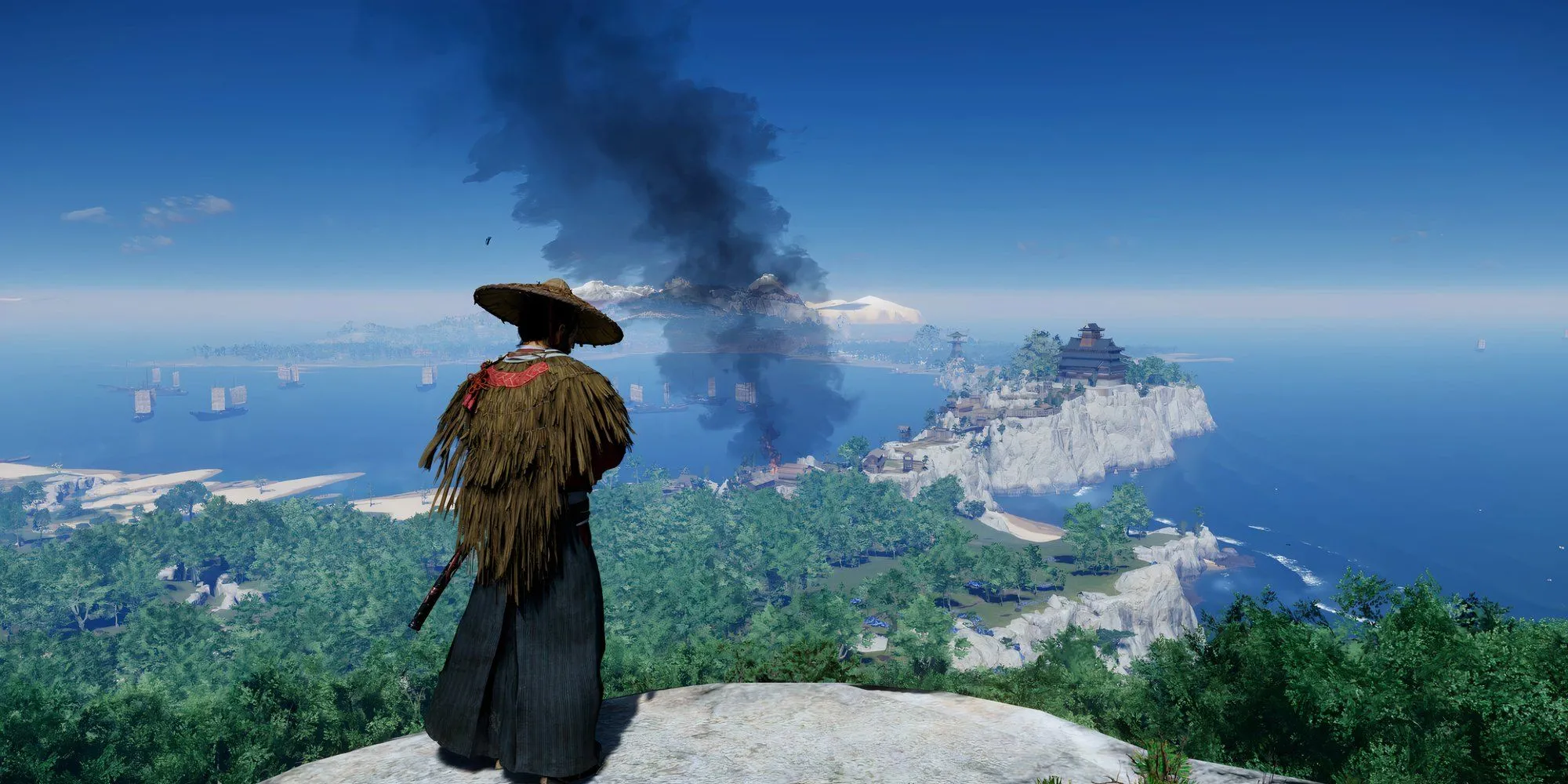 Jin Sakai đứng trên một vách đá nhìn xuống khung cảnh hùng vĩ của đảo Tsushima trong Ghost of Tsushima