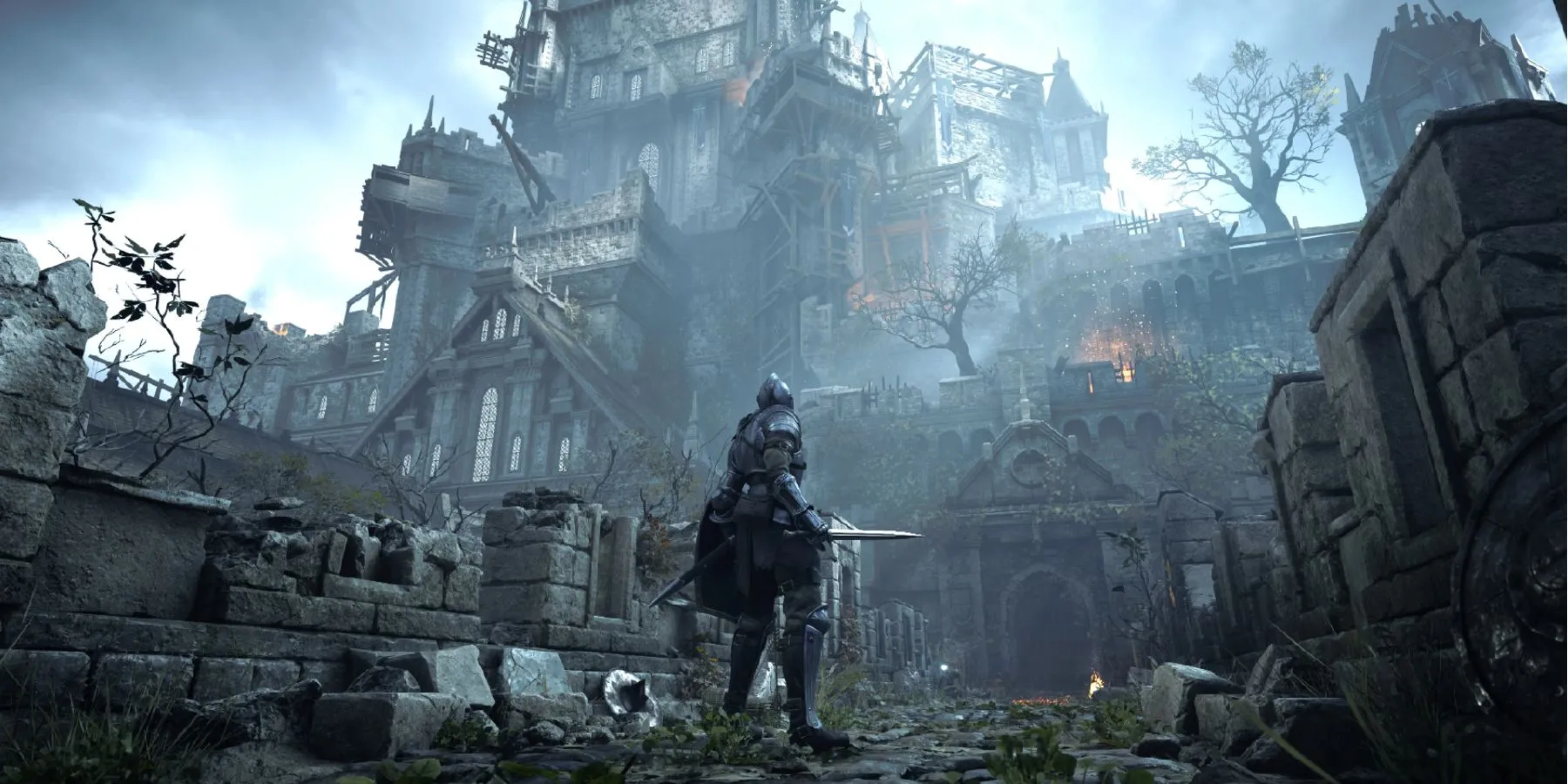 Khung cảnh hùng vĩ của Boletaria trong Demon's Souls Remake trên PS5, với kiến trúc gothic và bầu trời u ám