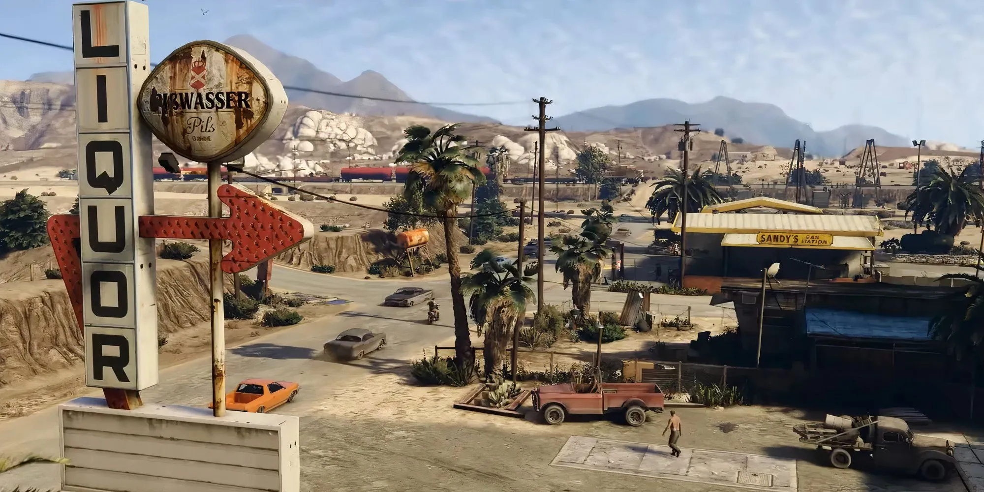 Khung cảnh sa mạc trong GTA 5 với những ngọn núi và cây cối thưa thớt.