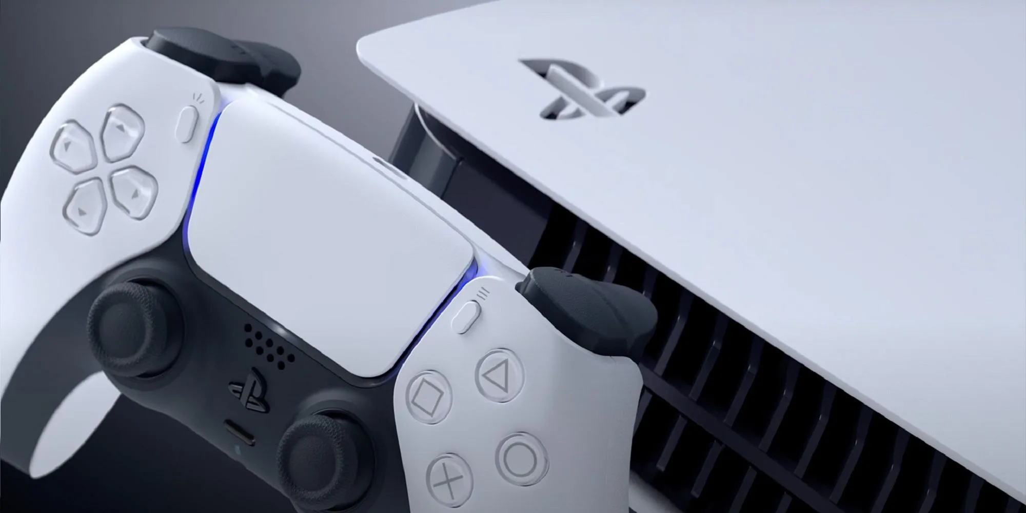 Máy chơi game PlayStation 5 màu trắng với thiết kế hiện đại đặt trên nền tối