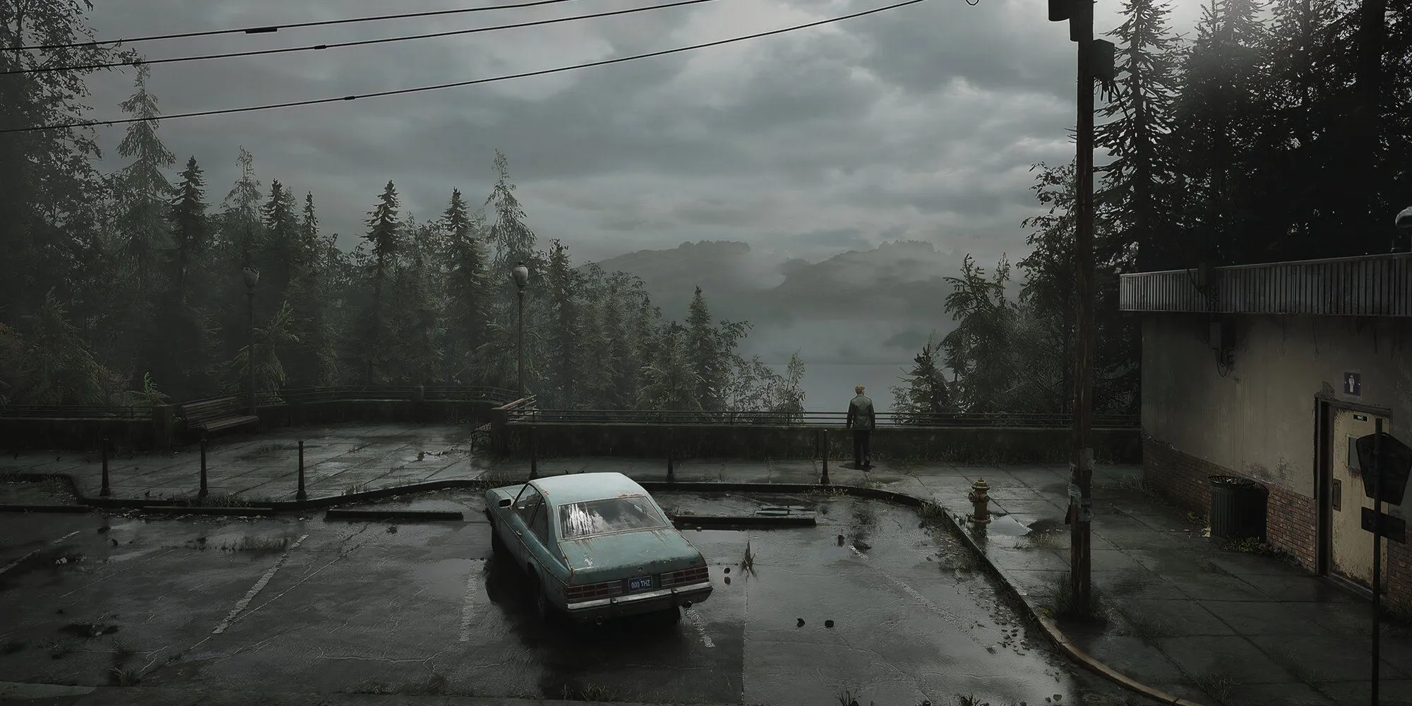 Nhân vật chính James Sunderland của Silent Hill 2 đứng một mình quay lưng ra ngoài trời