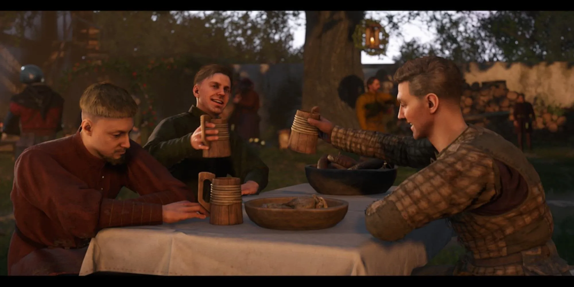 Nhân vật Henry và Hans Capon ăn uống trong quán rượu Kingdom Come Deliverance 2