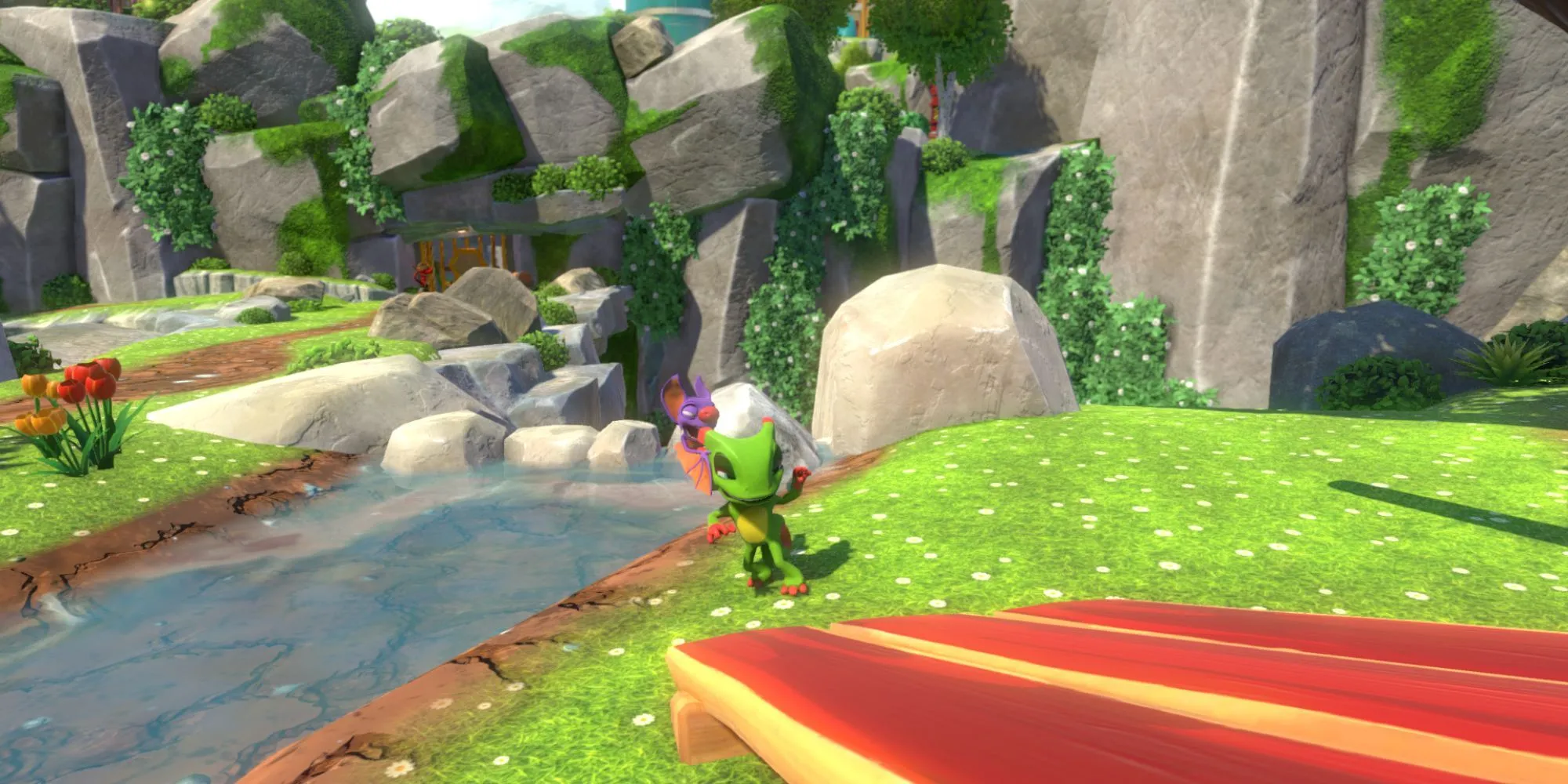 Nhân vật Yooka và Laylee đứng cạnh bờ sông trong game