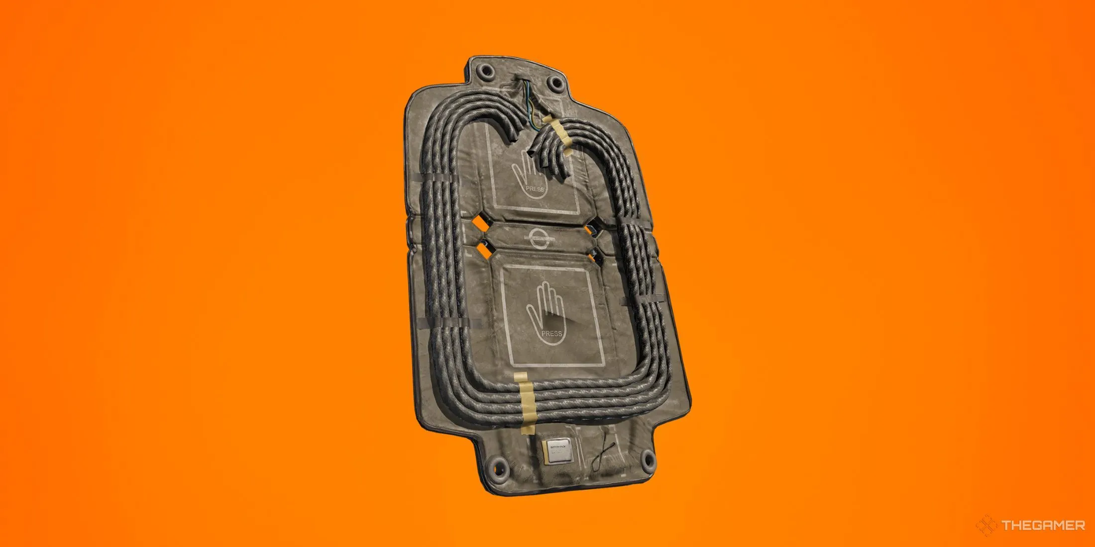 Thiết bị Breaching Charge trong Rainbow Six Siege chuẩn bị được kích hoạt, thường dùng để phá hủy tường mềm trong các trận đấu chiến thuật.