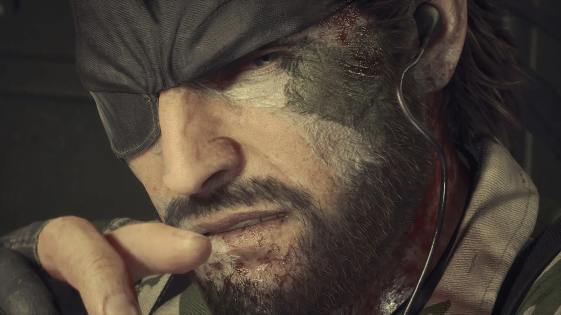 Naked Snake (Big Boss) trong một phân cảnh của Metal Gear Solid Delta, khoác lên mình bộ đồ lính và vẻ mặt nghiêm nghị